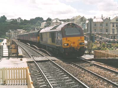 67021 heads a eastbound mail through Dawlish